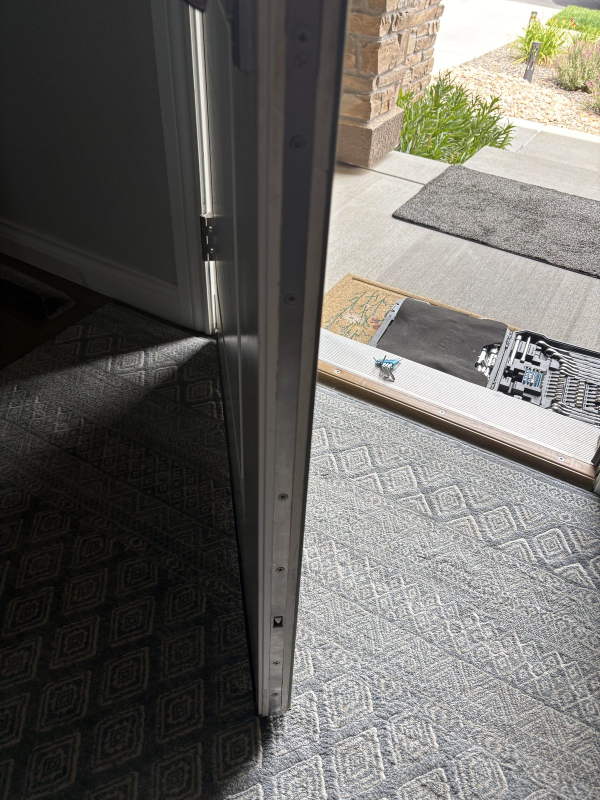 Mobile locksmith providing front door lock service in Colorado Springs