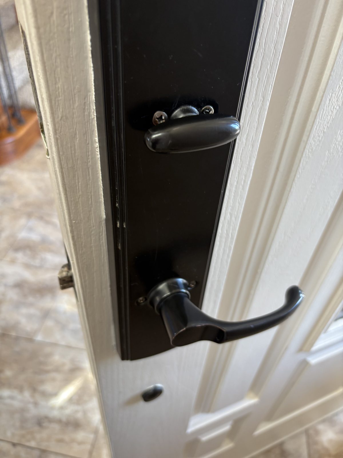 Residential front door handleset closeup for lock installation and repair in Colorado Springs